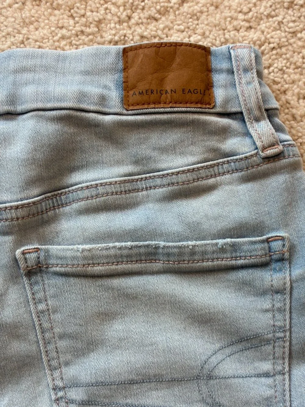 American Eagle Curvy High-Rise Shortie Stretch Jean Cross-Front Button Shorts - Picture 8 of 14